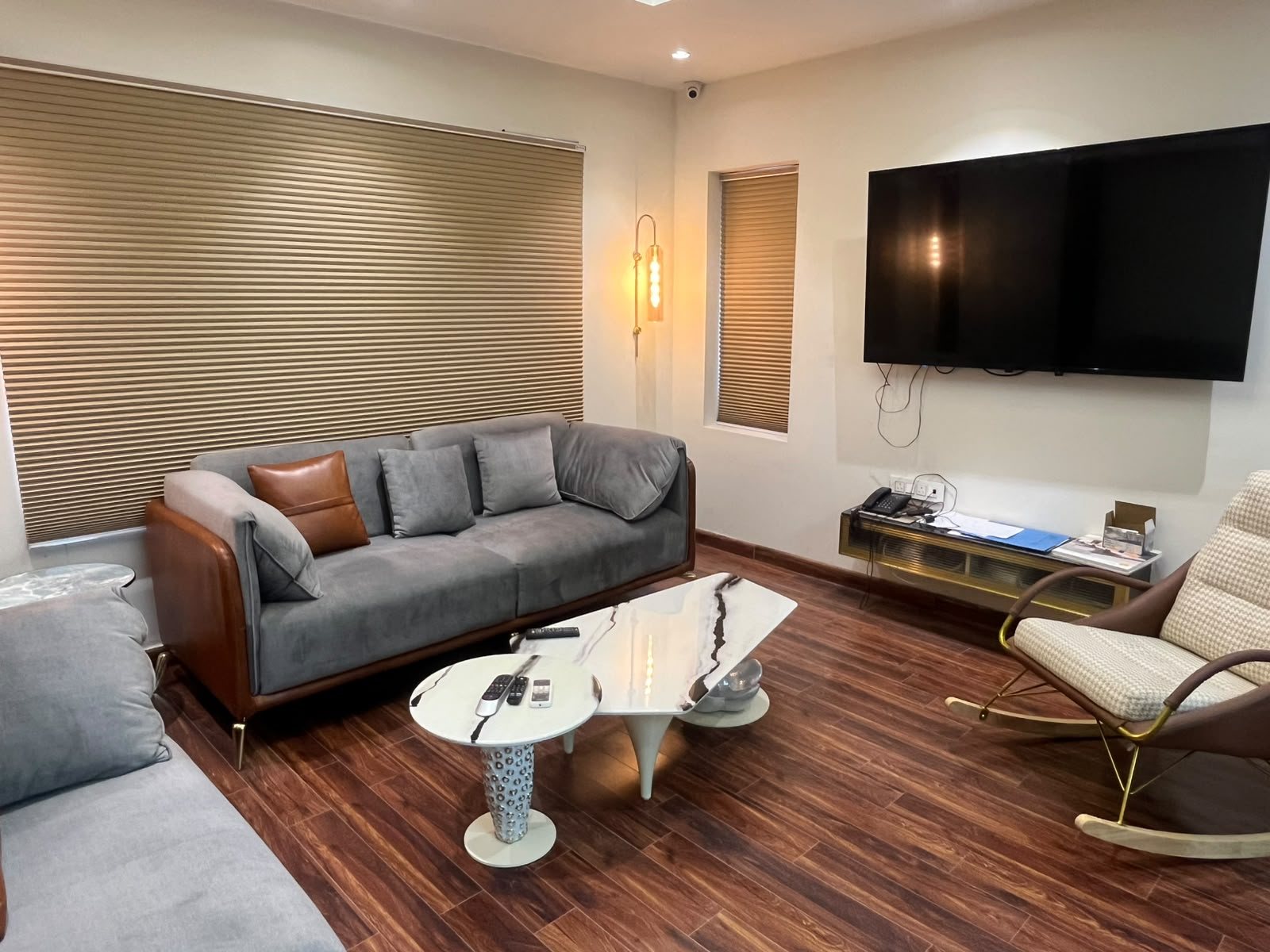 Lounge with sofas and a coffee table at a coworking space in Rohtak